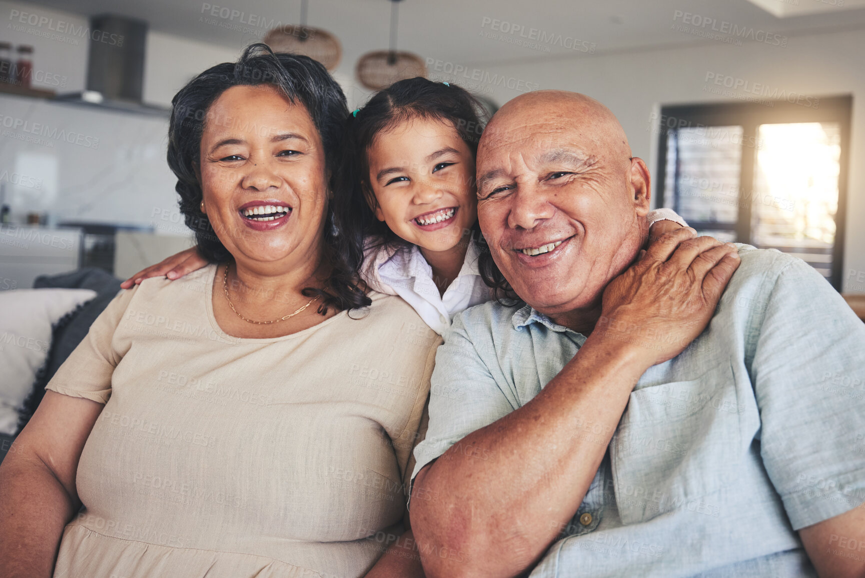 Buy stock photo Smile, hug and portrait of grandparents and child on sofa for happy, bonding and support. Love, happiness and relax with Mexico family and embrace in living room at home for calm, cheerful and peace