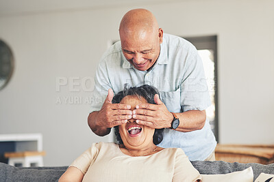 Buy stock photo Surprise, eyes closed and senior couple on sofa for happiness, relaxing and bonding in home. Marriage, happy and elderly man and woman with hands cover face for guess, fun and love in living room