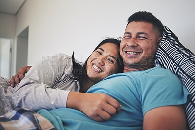 Buy stock photo Portrait, bed or happy couple hug in house with smile, care or support while bonding to relax together. Morning, man or woman lying in home bedroom with love, peace or loyalty in marriage commitment