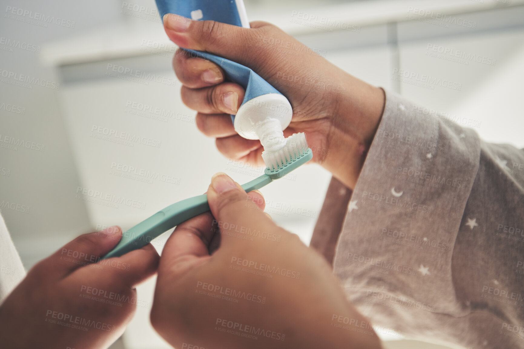 Buy stock photo Hands, brushing teeth and a parent teaching a child about dental care with a family in a bathroom together closeup. Toothbrush, toothpaste and dentist product with people in a home for oral hygiene