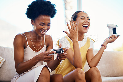 Buy stock photo Women on sofa playing video game, laughing and relax in home living room together on internet with controller. Online gaming, esports and happy gamer girl friends on couch on virtual app in apartment