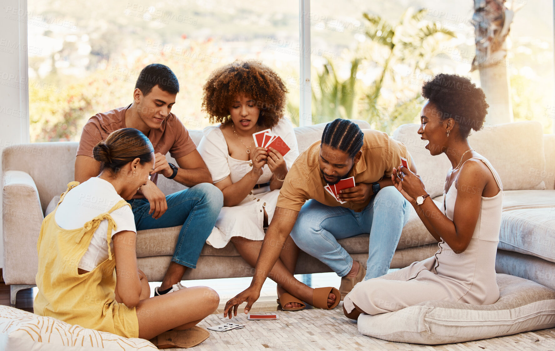 Buy stock photo Game, relax or friends playing cards, poker or black jack at home for gambling together in a holiday party. Diversity, men or group of happy women laughing in living room in a fun match competition