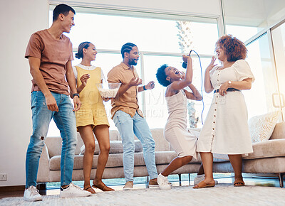 Buy stock photo Karaoke, entertainment and friends singing in the living room with a microphone to music, playlist or radio. Happy, diversity and young people dancing, bonding and having fun together at an apartment