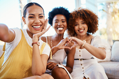 Buy stock photo Portrait, heart hands and selfie of friends in home living room, bonding and having fun on sofa. Face, profile picture and love sign of group of women in photography, happy memory and emoji for care