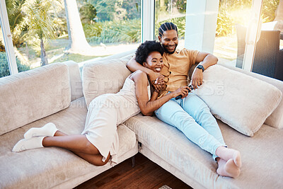 Buy stock photo Happy, above and a black couple on the sofa, watching tv and talking in a house. Smile, love and an African man and woman with care, speaking and conversation on the living room couch for a movie