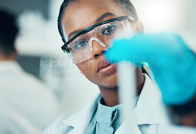 Buy stock photo Science, study and black woman with test tube in laboratory, medical engineer and results. Biotechnology, pharmaceutical and research, scientist or lab technician checking vaccine solution in glass.