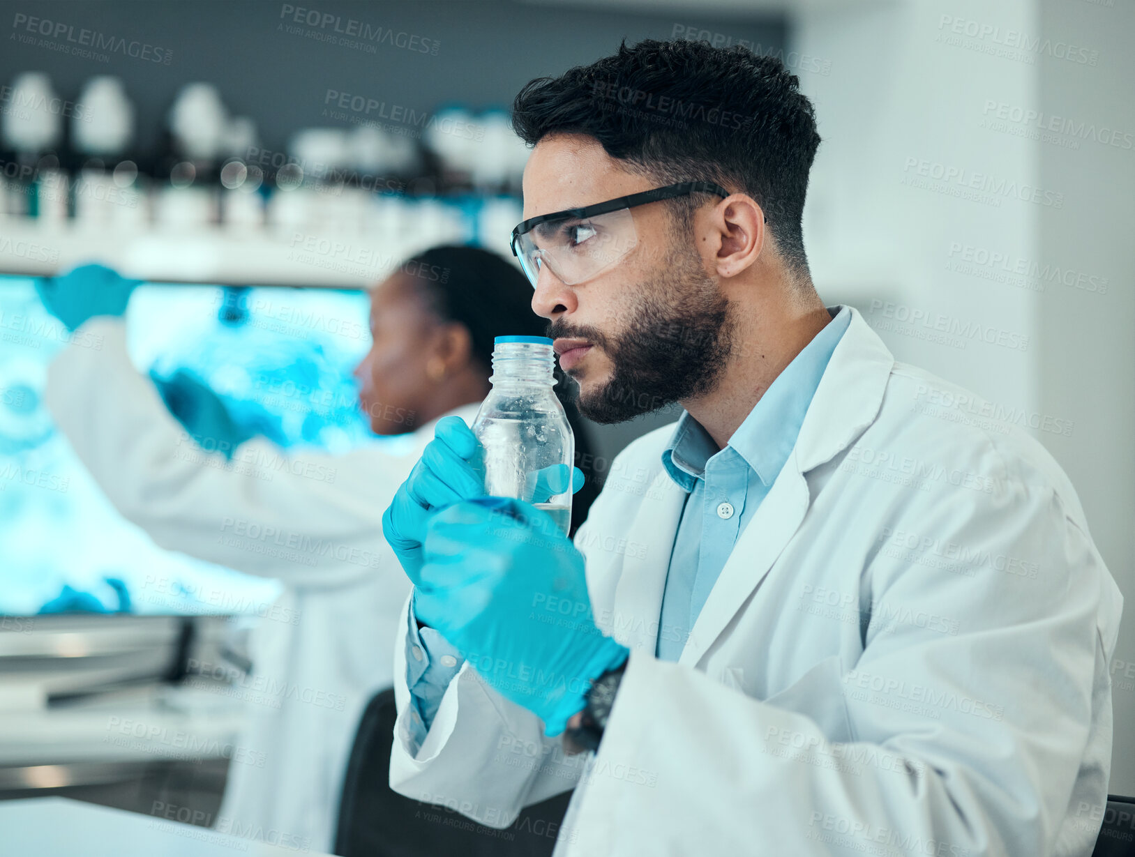 Buy stock photo Science, smell and chemical with man in laboratory for liquid analysis. medical and pharmacy. Medicine, healthcare and results with scientist and beaker for virus vaccine, test and research exam