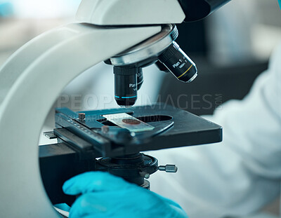 Buy stock photo Microscope, medical science and blood sample in a laboratory for analysis, study or development. Zoom on equipment for research, future and gloves of scientist with virus, particle or dna test