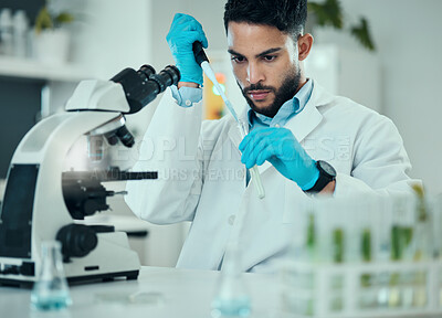 Buy stock photo Science, results and man with test tube in laboratory, research and medical engineering at microscope. Biotechnology, pharmaceutical and study, scientist or lab technician checking solution in glass.