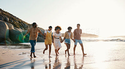 Buy stock photo Summer, friends and people happy at sunset beach for fun, holding hands and travel with love. Diversity, men and women group in nature with sand, freedom and happiness on a vacation or holiday