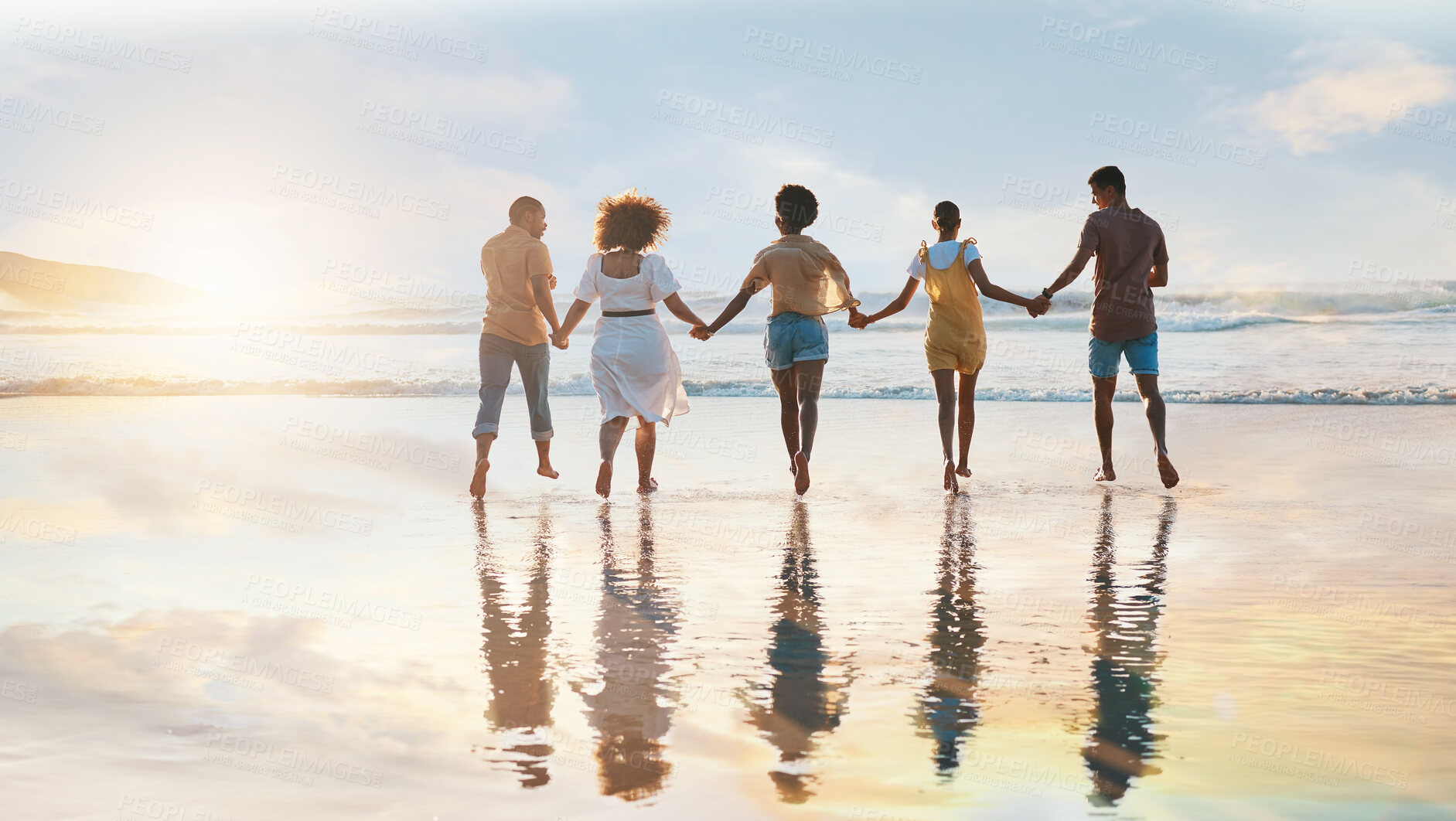 Buy stock photo Friends, together and holding hands on beach at sunset in summer, vacation or walking on holiday break with support. Group, silhouette and people with connection, respect and kindness in community