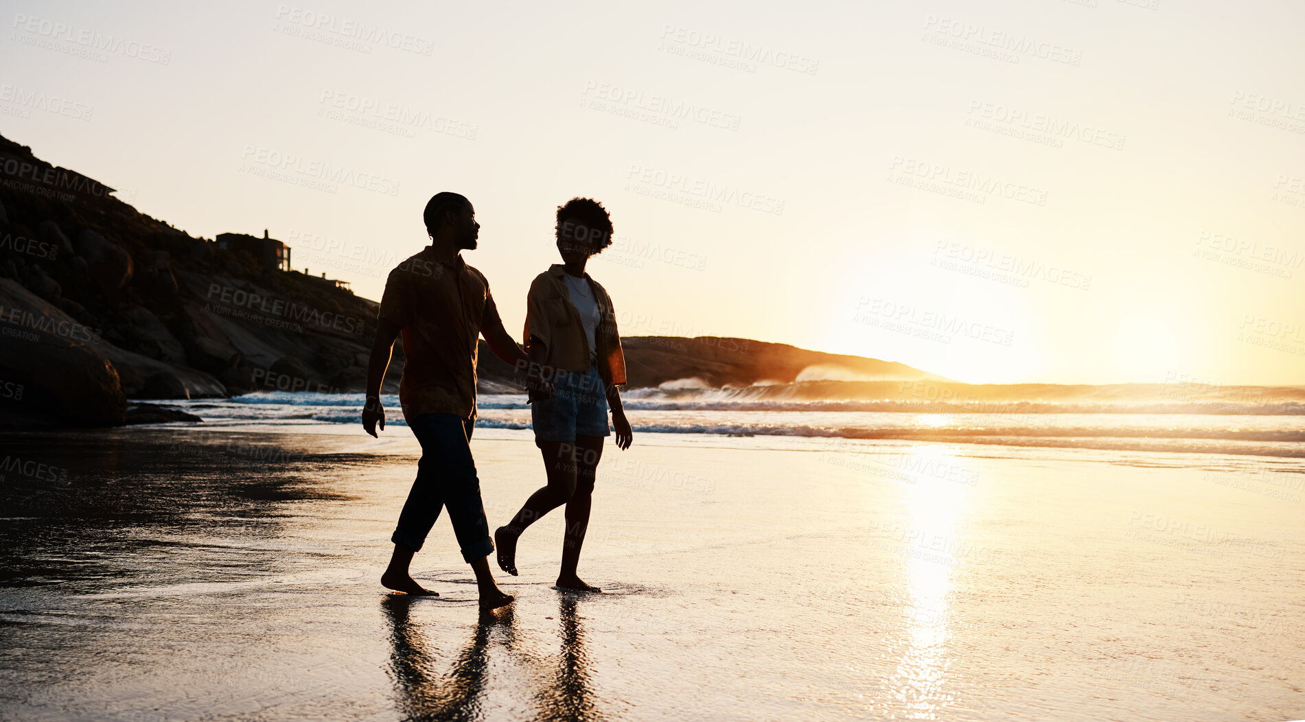 Buy stock photo Beach, sunset and silhouette couple walking on sand, holding hands and enjoy romantic time together. Wellness, summer freedom and dark shadow of people bonding, talking and relax on tropical date