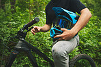 Mountain bike, man and helmet, forest and sports with adventure and fitness in nature outdoor. Cycling, biker and travel with athlete, exercise training and ready to ride, bicycle and challenge