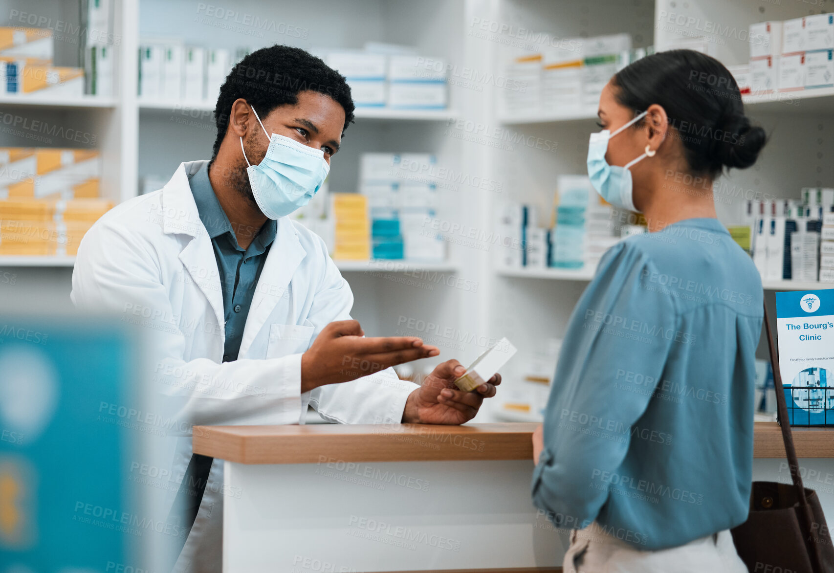 Buy stock photo Pharmacist, face mask or black man giving pills to woman patient in customer service for wellness advice. Healthcare help, African pharmacy or doctor with pharmaceutical medicine or medical product