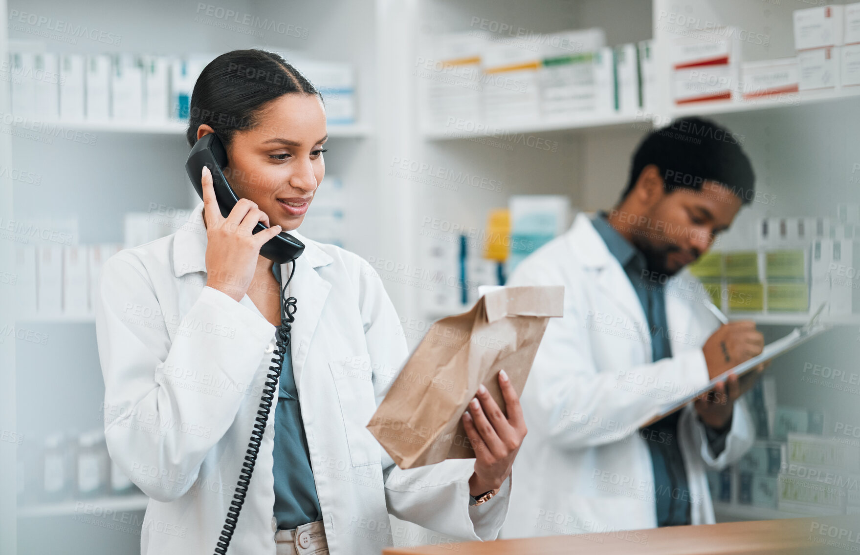 Buy stock photo Pharmacist, telephone and medicine package for customer service, healthcare communication and inventory support. Medical worker, people or doctor on phone call with pharmacy product or paper bag