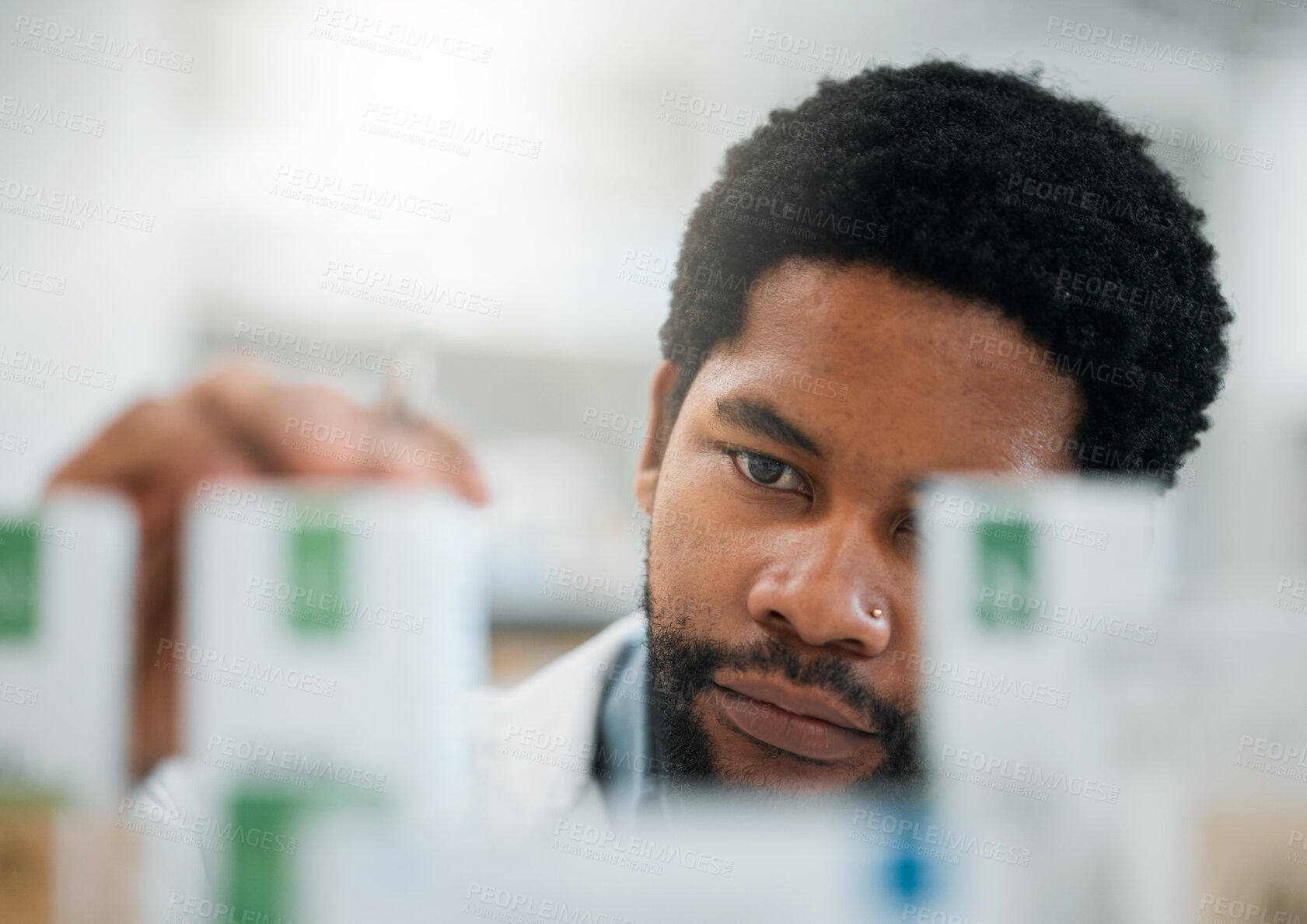 Buy stock photo Black man, pharmacist, drugs and health with medicine, prescription and organize stock in pharmacy. Pills, inventory with healthcare and African medical worker, hospital dispensary and pharmaceutical