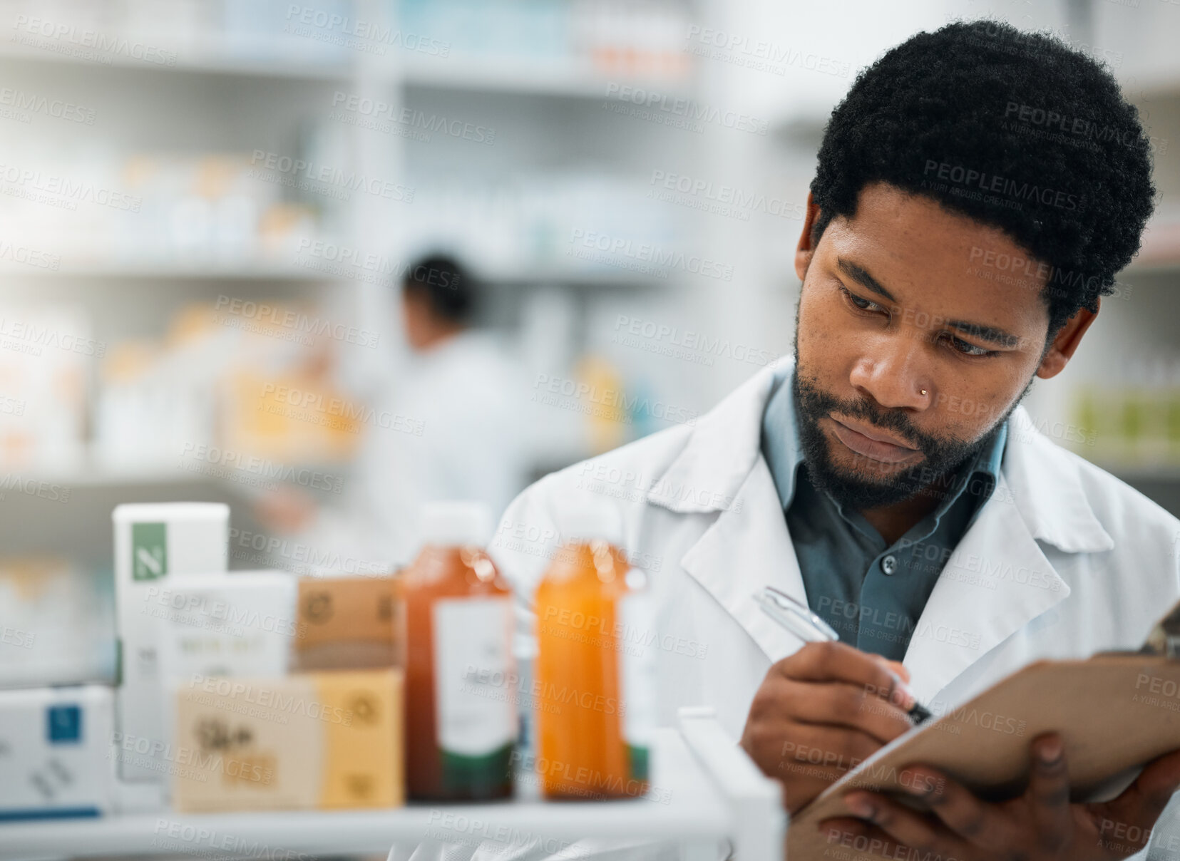 Buy stock photo Pharmacist, checklist and medicine inventory, healthcare stock and survey or inspection for quality assurance. Medical African man or doctor writing on clipboard for drugs, product or pharmacy pills