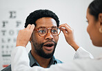 Consulting, wow and optometry with black man and glasses for medical, shopping and help. Healthcare, ophthalmology and eye care with patient and doctor for surprise, advice and lens prescription