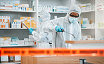 Biohazard, spray and disinfect with people in a pharmacy for decontamination after a medical accident. Hazmat, chemical or cleaning with healthcare personnel in a drugstore to sanitize and isolate