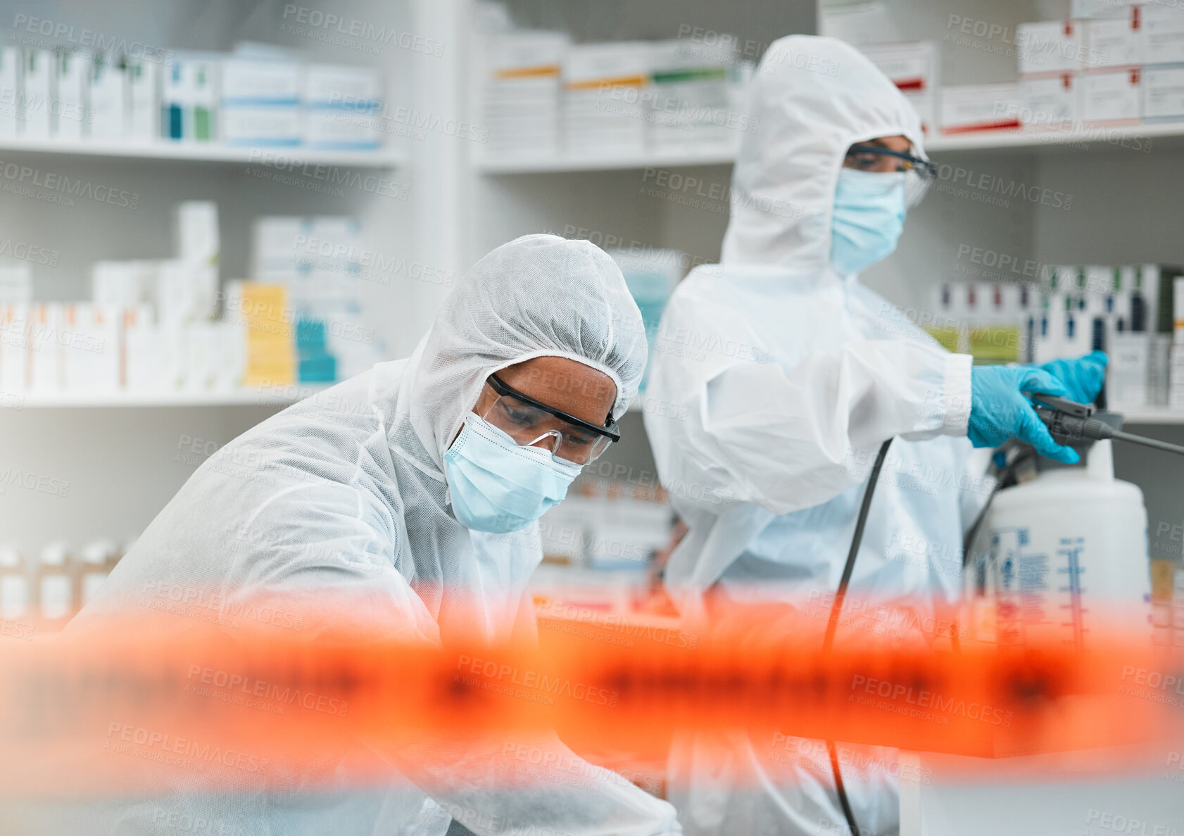 Buy stock photo Pharmacy disinfection, red tape and people spray chemical solution for protection, cleaning hospital or contaminated clinic. Safety policy, hazmat PPE and healthcare team sanitize medical product