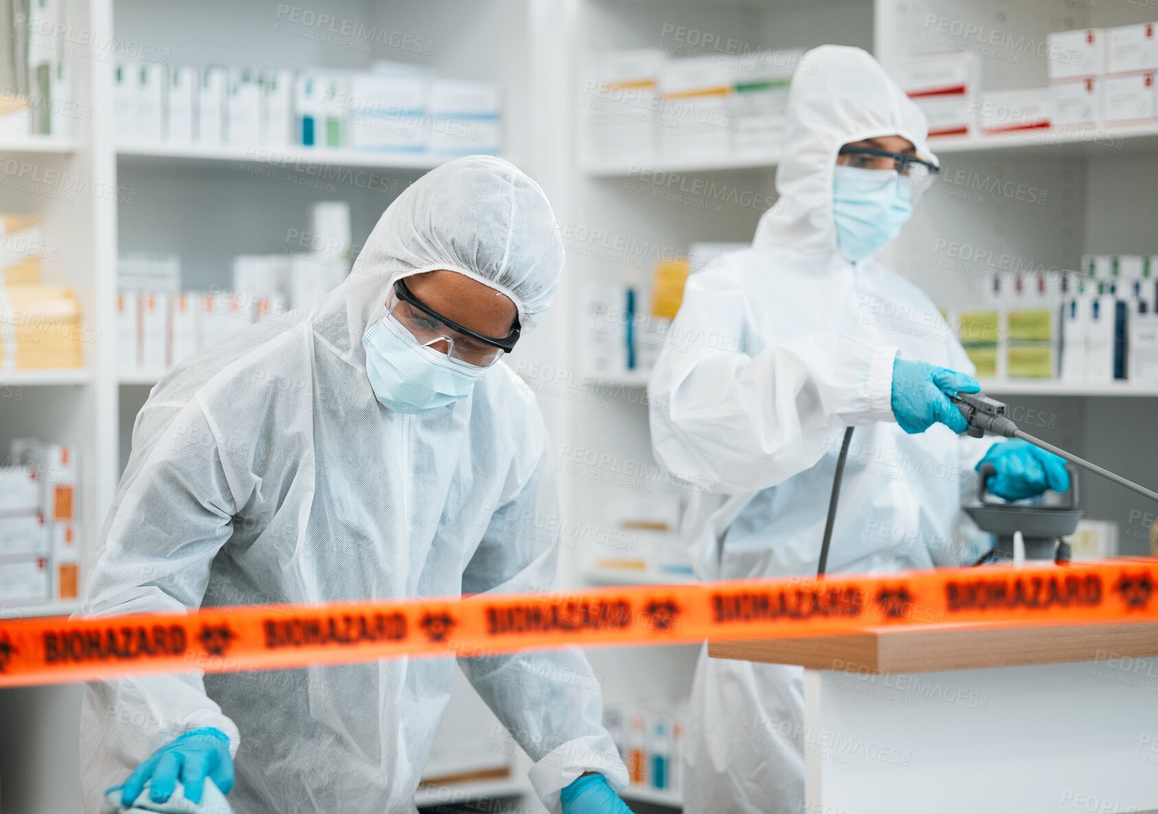 Buy stock photo Biohazard, chemical and cleaning with people in a pharmacy for decontamination after a medical accident. Hazmat, spray or disinfect with healthcare personnel in a drugstore to sanitize and isolate