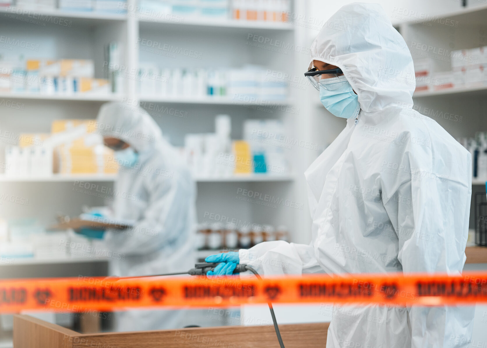 Buy stock photo Biohazard, chemical and disinfect with people in a pharmacy for decontamination after a medical accident. Hazmat, spray or cleaning with healthcare personnel in a drugstore to sanitize and isolate