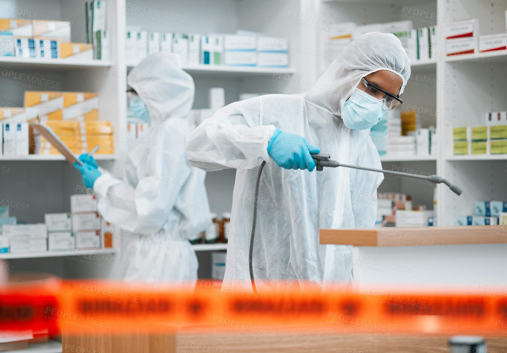 Buy stock photo Hazmat, chemical and disinfect with people in a pharmacy for decontamination after a medical accident. Biohazard, spray or cleaning with healthcare personnel in a drugstore to sanitize and isolate