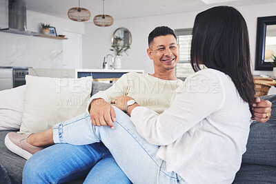 Buy stock photo Conversation, relax and couple on a sofa in the living room talking and bonding together at home. Happy, love and husband speaking and resting with his wife in the lounge of their modern house.