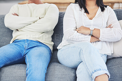 Buy stock photo Frustrated couple, hands and fight in divorce, conflict or disagreement on living room sofa at home. Closeup of man and woman in breakup, cheating affair or dispute from toxic relationship in house