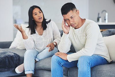 Buy stock photo Frustrated couple, headache and disagreement in divorce, conflict or argument on living room sofa at home. Unhappy man and woman in breakup, cheating affair or fight from toxic relationship in house