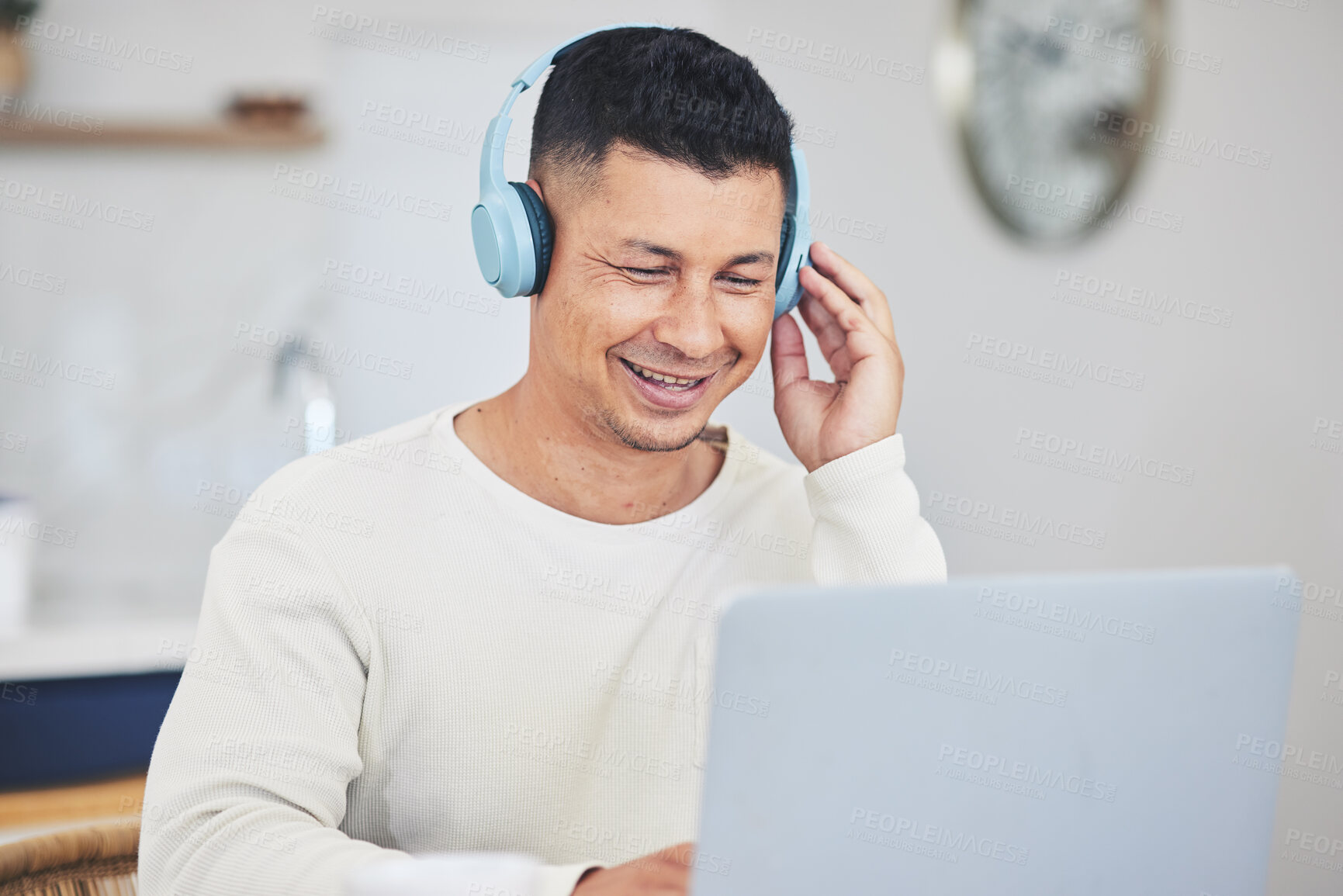 Buy stock photo Remote work from home, smile and man with a laptop, headphones and typing with research for a project. Person, employee or copywriter with a pc, lounge or happiness with connection or search internet