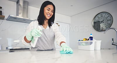 Buy stock photo Happy woman, housekeeper and cleaning kitchen table with spray bottle, detergent or bacteria and germ removal at home. Female person maid or cleaner wiping surface with cloth in hygiene or sanitise