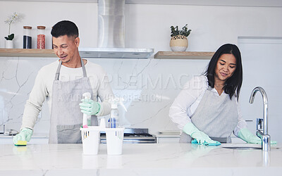 Buy stock photo Happy couple, housekeeper and cleaning table in kitchen, chemical equipment or detergent in bacteria and germ removal at home. Man and woman wiping surface with cloth together in hygiene to sanitise