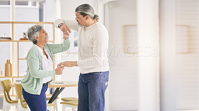 Buy stock photo Mature couple, dancing and happy at home for anniversary, birthday or valentines celebration. Laugh, love and care of a man and woman for healthy marriage, happiness and romance with mockup space