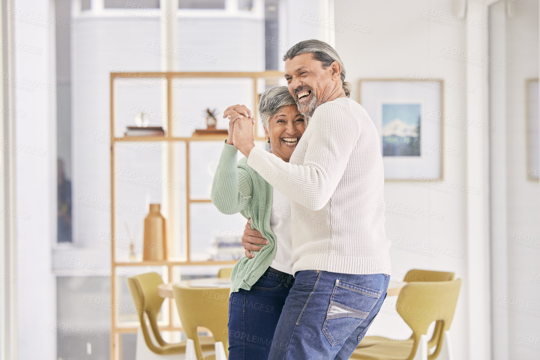 Buy stock photo Dancing, mature couple and happy at home for anniversary, birthday or valentines celebration. Laugh, love and care of man and woman for healthy marriage, happiness and moving to music or funny laugh