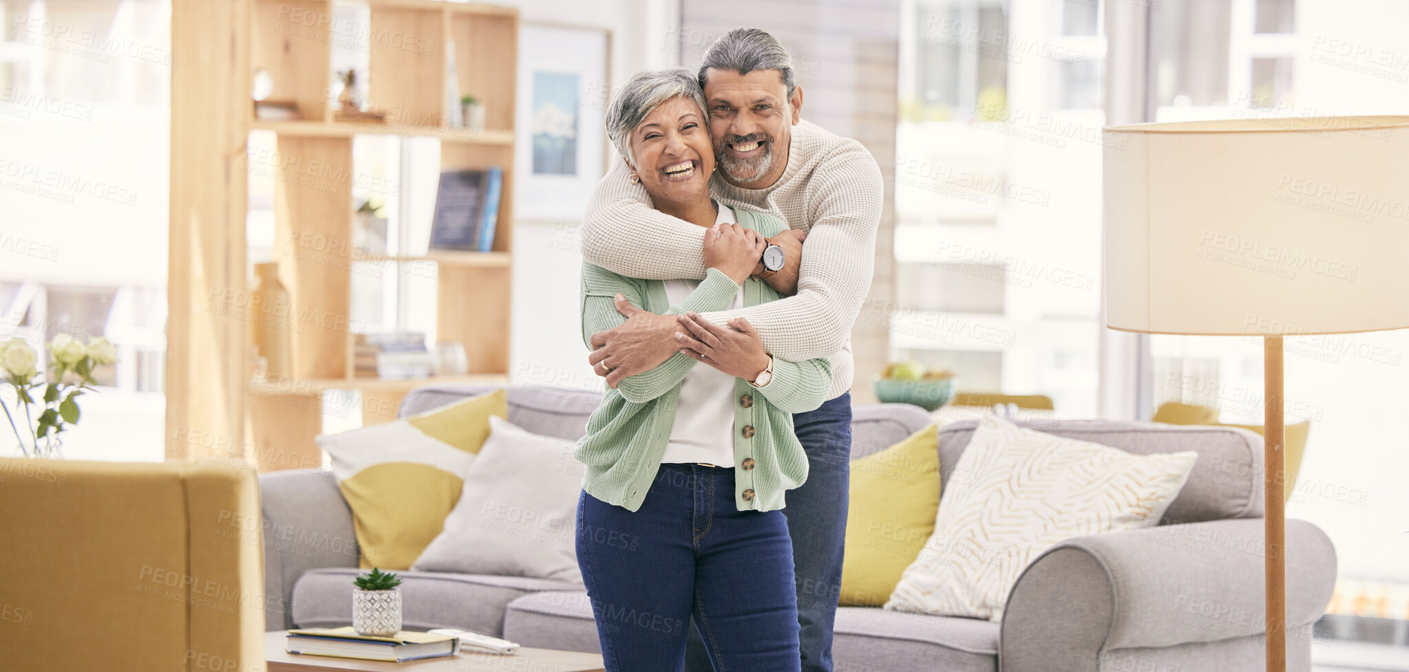 Buy stock photo Portrait, hug and senior couple with love, home and happiness with care, bonding and retirement. Lounge, old man and mature woman embrace, affection and loving together with marriage and relationship