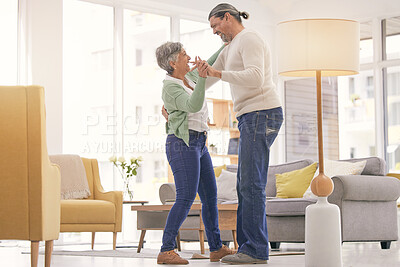 Buy stock photo Home, dancing and a happy mature couple on anniversary, birthday or valentines day celebration. Holding hands, love or care of man and woman with healthy marriage, happiness and moving to music