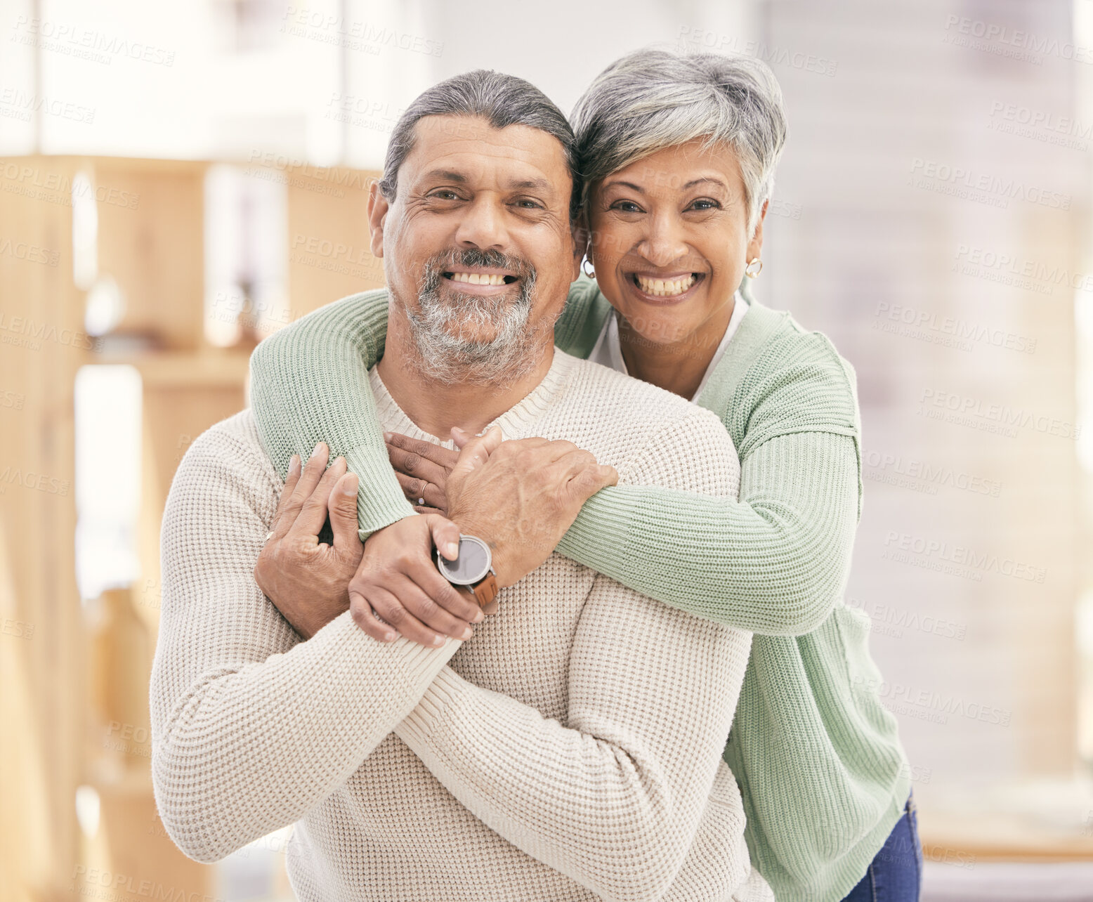 Buy stock photo Happy elderly couple, portrait and hug with love in living room bonding, romance or embrace together at home. Mature man or woman smile in happiness for loving relationship, affection or commitment