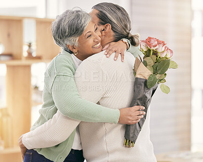 Buy stock photo Mature couple, flowers and hug at home for anniversary, birthday or valentines celebration. Surprise, love and roses or bouquet with a man and woman for healthy marriage, happiness and romance