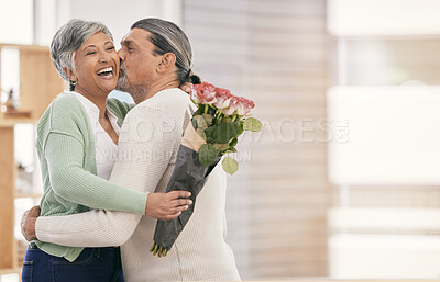 Buy stock photo Mature couple, flowers and kiss at home for anniversary, birthday or valentines celebration. Surprise, love and roses bouquet with a man and woman for healthy marriage, happiness and mockup space