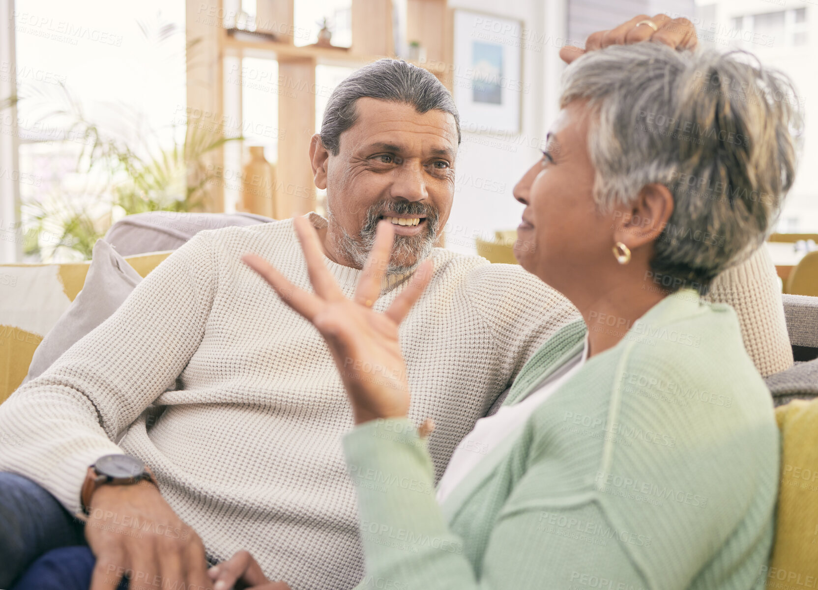 Buy stock photo Love, mature couple and talk on sofa in home for happy chat, care and conversation together with marriage partner. Man, woman and speaking on couch in support, loyalty or communication in living room