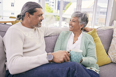 Buy stock photo Relax, conversation and mature couple on sofa for bonding, healthy relationship and connection with coffee. Marriage, love and happy man and woman drinking tea on couch in discussion, talking or chat