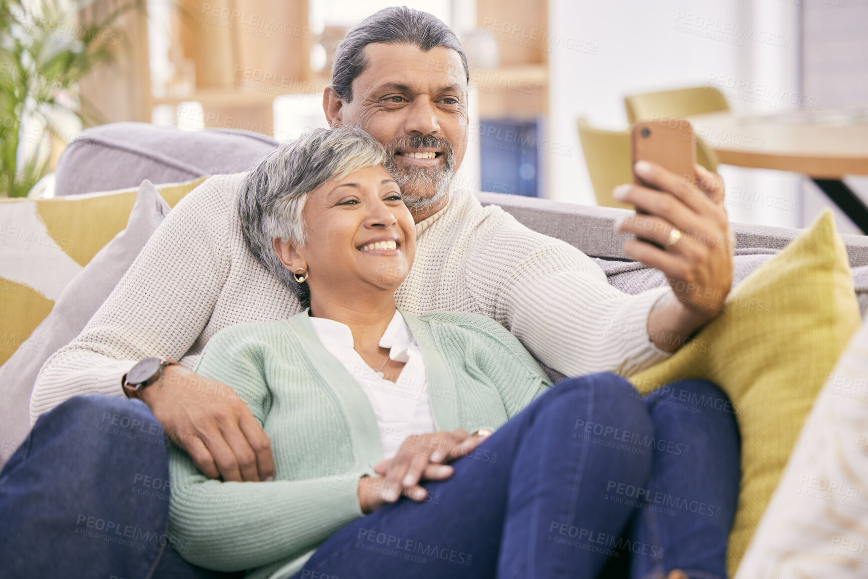 Buy stock photo Selfie, happy and mature couple on couch with smile for social media post, profile picture and memories. Marriage, love and man and woman take photo in living room for bonding, relationship and relax