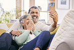 Happy, selfie and a senior couple with a phone on the sofa for communication, social media or a video call. Smile, house and an elderly man and woman taking a photo with a mobile on the couch