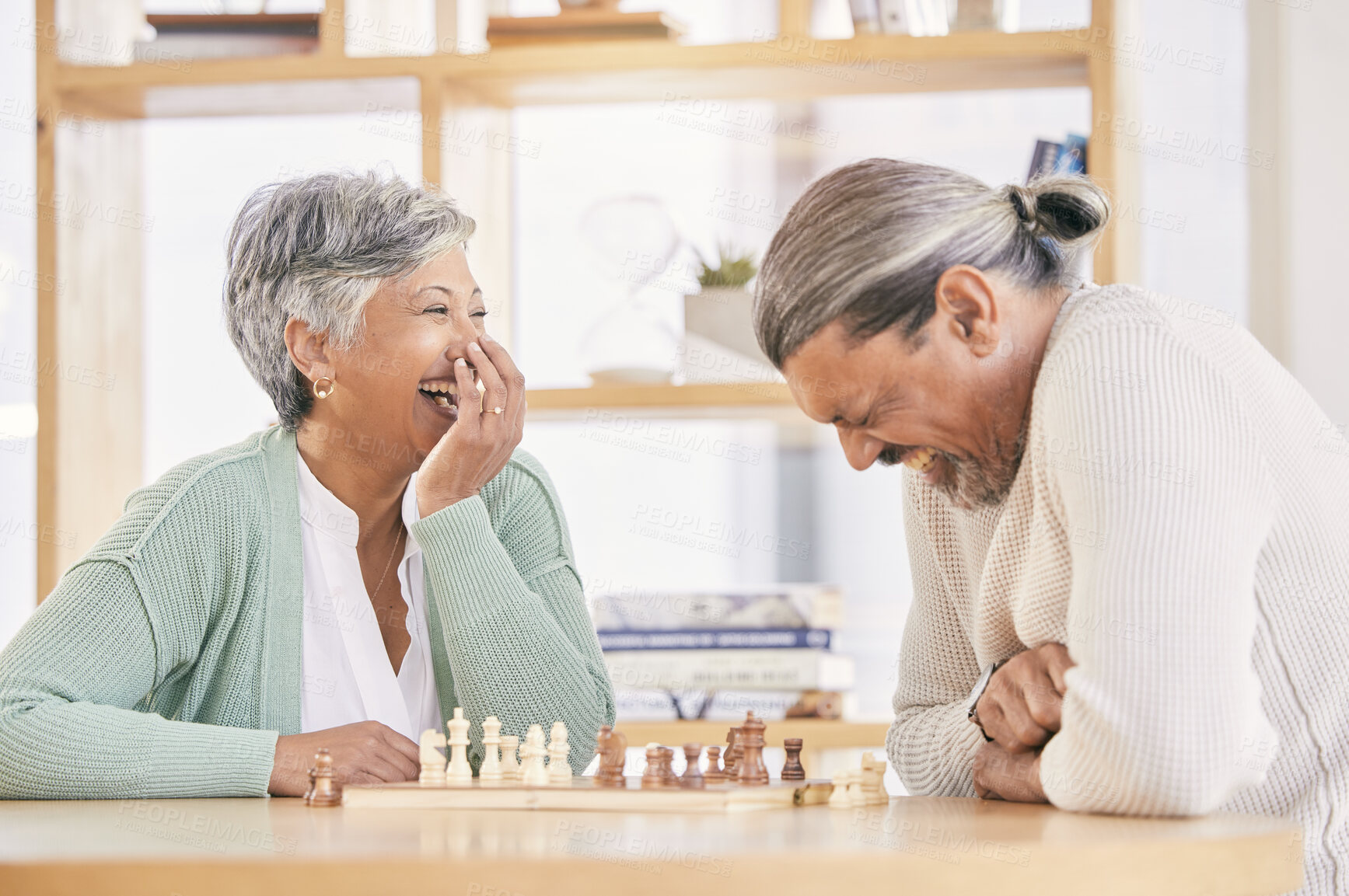 Buy stock photo Chess, laugh and senior couple play games for relaxing, bonding and spending time together at home. Marriage, retirement and happy man and woman enjoy board game for challenge, strategy and thinking