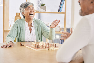 Buy stock photo Laughing, game and senior couple with chess in a house in retirement for a competition. Happy, together and a funny and elderly man and woman with a board for a challenge or bonding with conversation