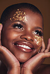 Gold, makeup and woman face closeup with a smile from luxury treatment and facial spa mask. Glitter, golden dermatology and African female person happy from skincare and golden cosmetics in studio