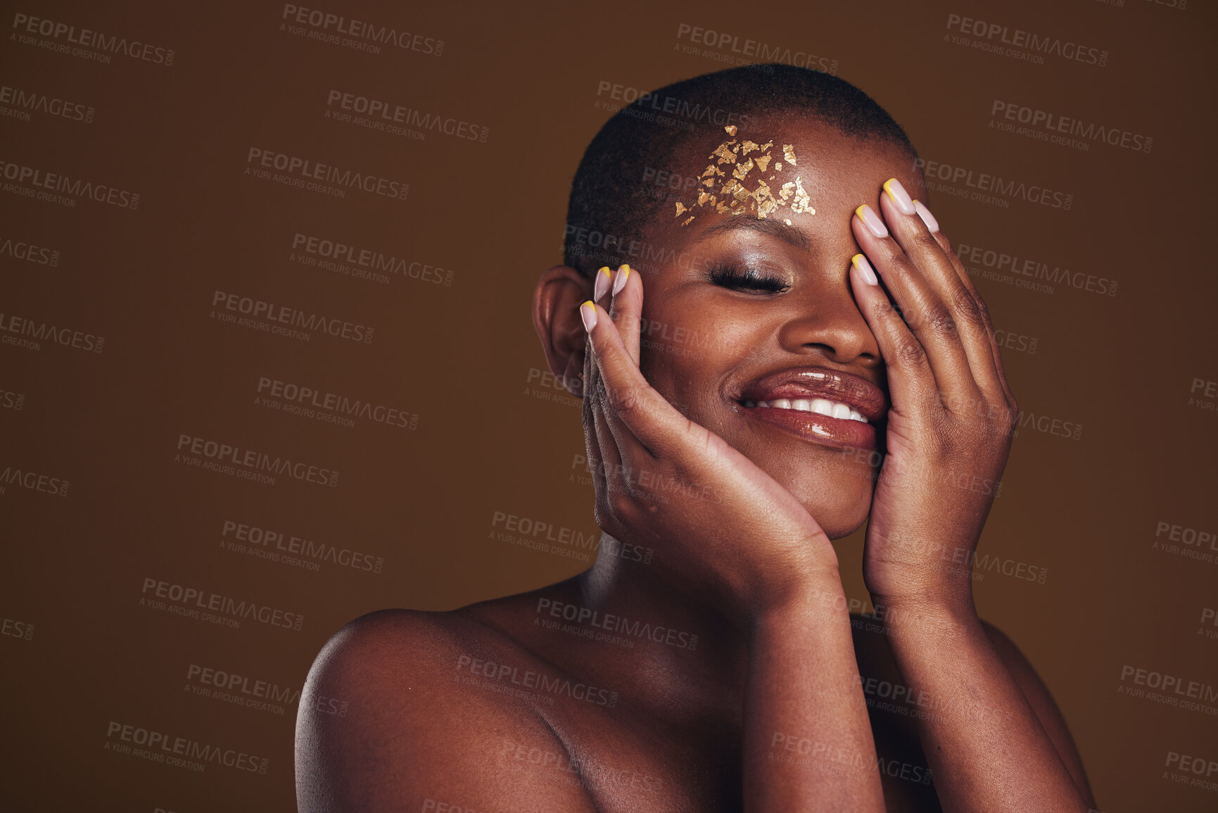 Buy stock photo Art, beauty and black woman with gold makeup on brown background, glitter paint and cosmetics mockup. Shine, glow and African model in studio space for fashion, aesthetic freedom and luxury skincare.