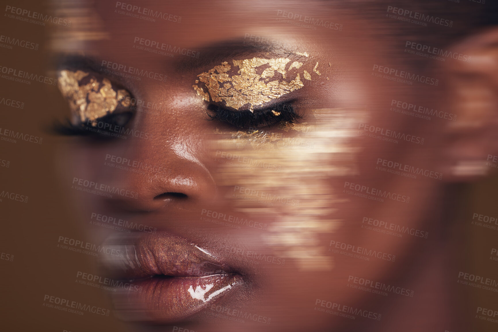 Buy stock photo Gold beauty, blurred and black woman with face closeup with makeup and cosmetics in studio. Brown background, African female model and glitter with golden shine and glow from facial paint sparkle