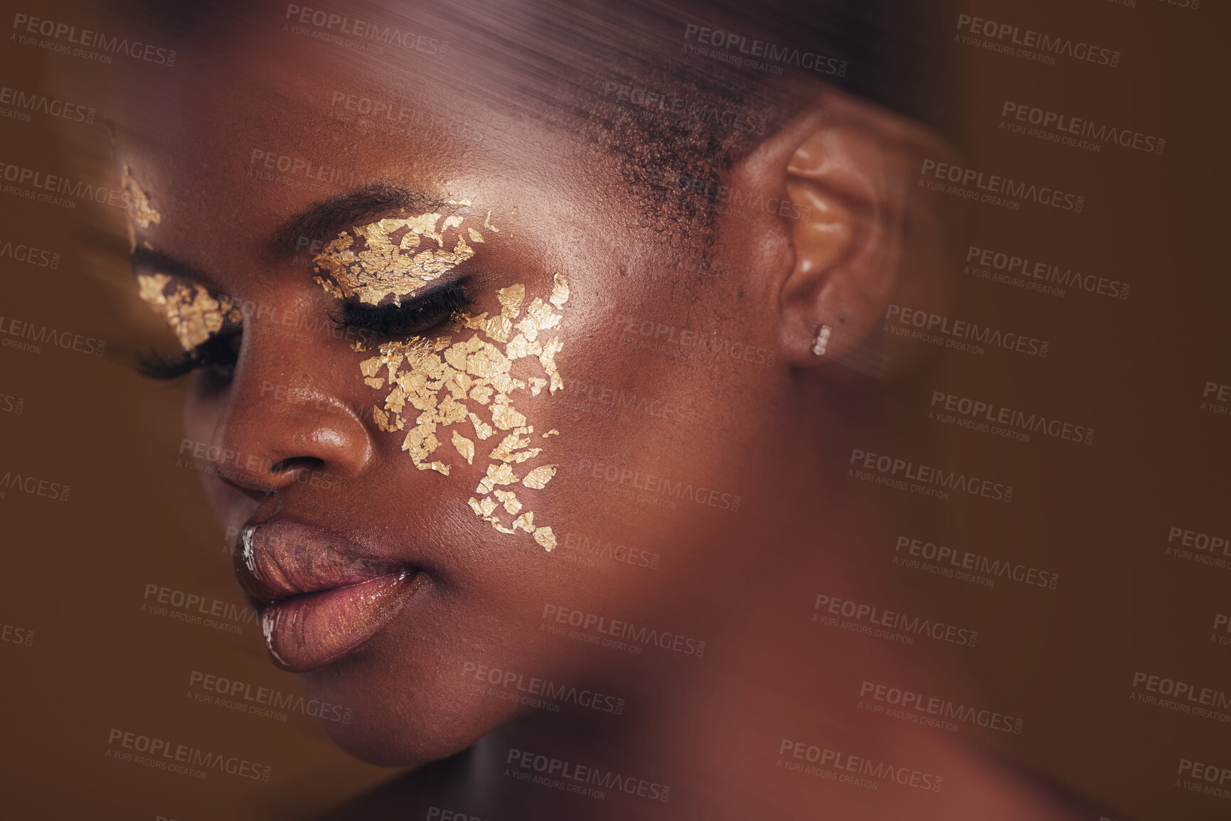 Buy stock photo Gold beauty, blur and black woman with makeup and face closeup with cosmetics in studio. Brown background, African female model and glitter with golden shine and glow from facial paint sparkle